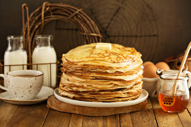 Stack of thin russian pancakes or crepes Stack of thin russian pancakes or crepes made for shrove Tuesday or Maslenitza, spring celebration slavic culture stock pictures, royalty-free photos & images