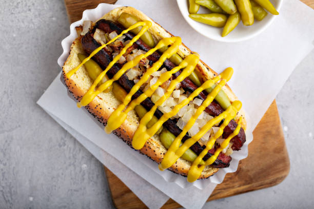 istock Hot dog on a poppy seed bun with onion 1326498539