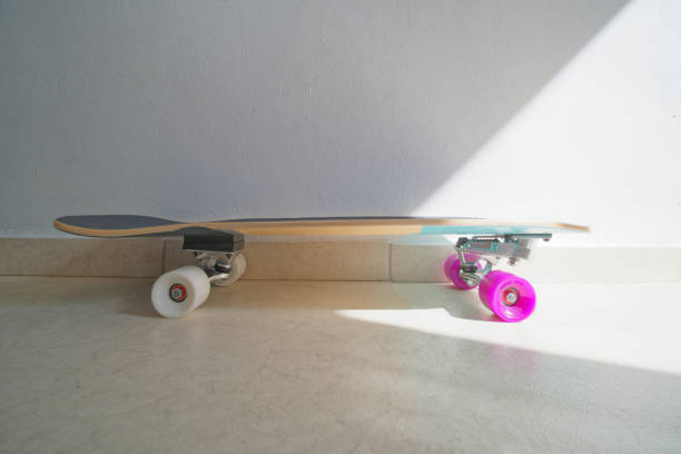 istock Skateboard, surf skate at home lit bright sunlight from window. 1326501300