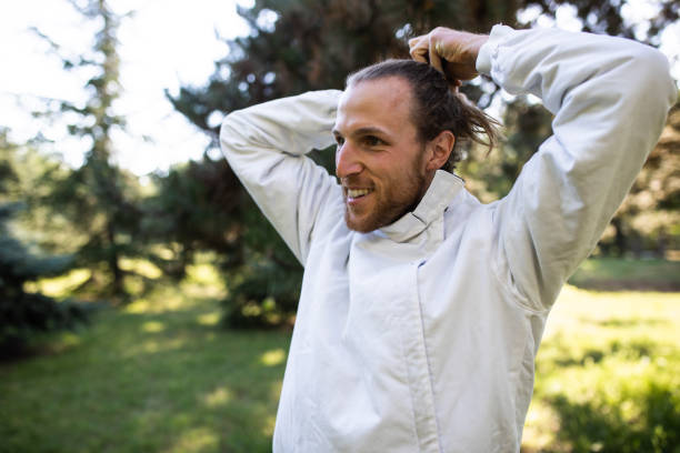 istock A young man tying his hair before fencing practice 1326503308