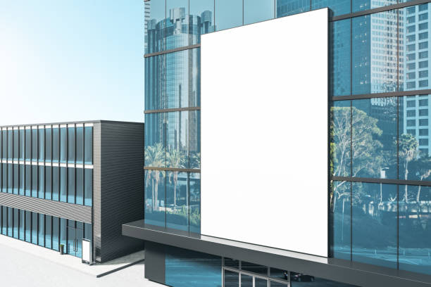 istock Empty white poster on shiny glass building exterior with reflections and daylight. Mock up, 3D Rendering. 1326503648