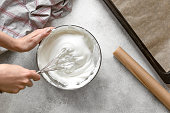 Process of making french meringue. Whipped eggs.