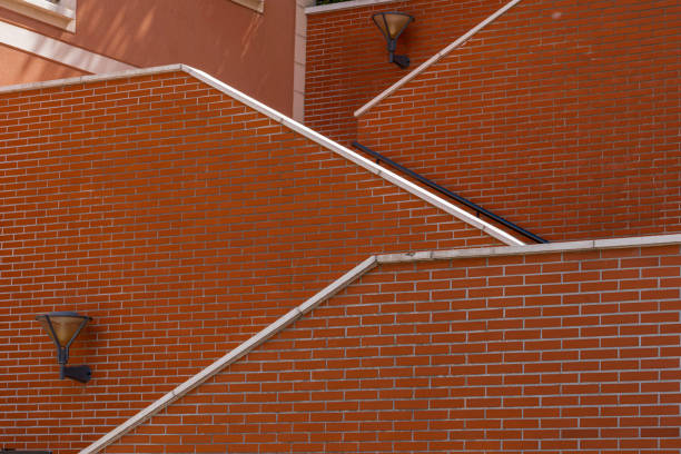 Nanterre, France - 05 02 2021: La Defense district. Graphic staircase and red brick wall