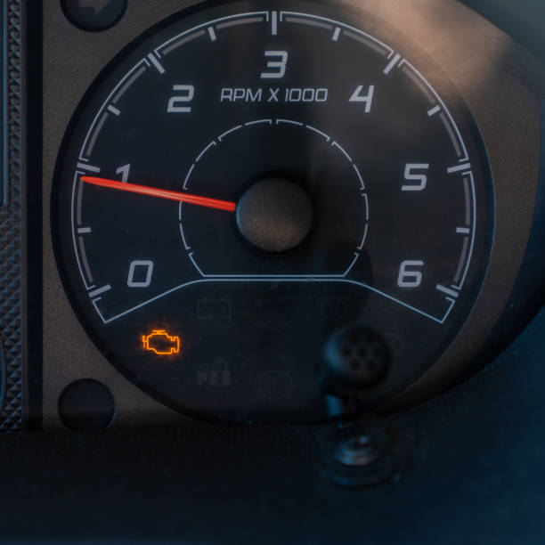 istock close up square view of the bright orange engine trouble light illuminated on a dashboard dial in a vehicle 1326507095