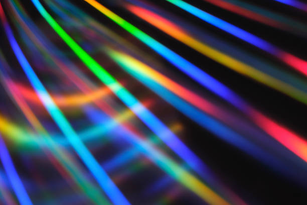 istock Holographic neon background. Neon rainbow strips on dark background. Soft focus Abstract rainbow color wave strips horizontal background 1326508307