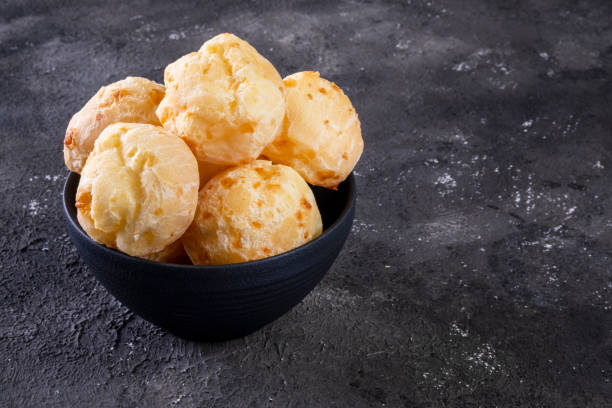 istock black bowl with cheese breads on dark background 1326511689