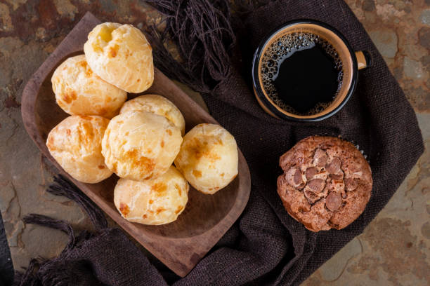 delicious cheese breads, chocolate muffins and a coffee mug - muffin cheese bakery breakfast imagens e fotografias de stock