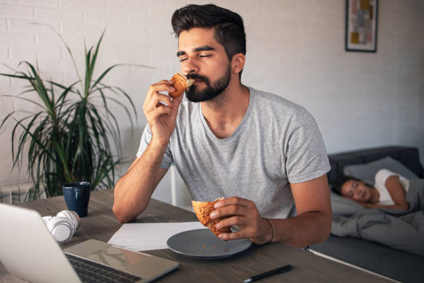 enjoying breakfast with eyes closed - food staple audio imagens e fotografias de stock