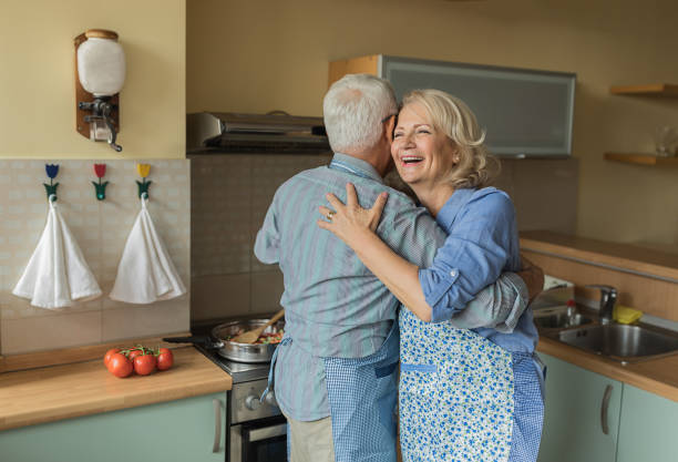 istock Happy Older Man and his Wife are Spending a Nice Time While Enjoying in Dinner Preparation at Home. 1326515246