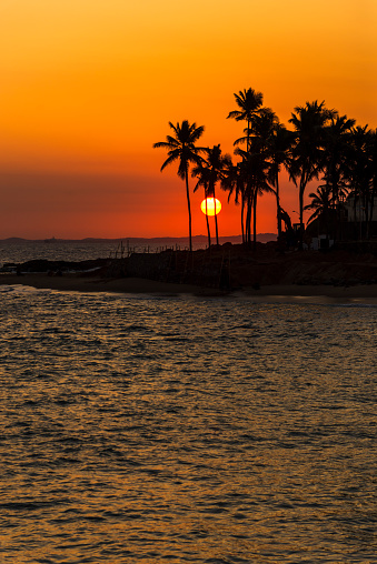 Beautiful sunset with silhouettes and orange color on the beach of Ondina in Salvador, Bahia, Brazil.