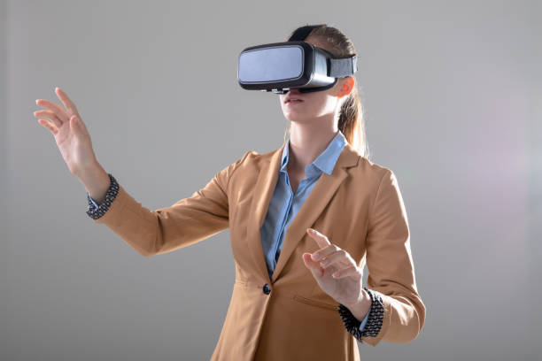 istock Caucasian businesswoman wearing vr headset touching virtual interface, isolated on grey background 1326519590