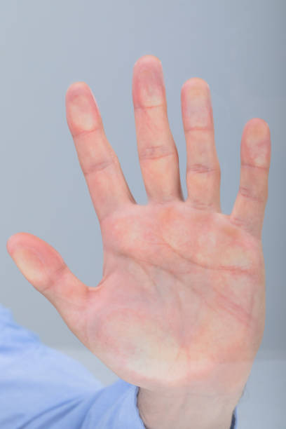 istock Close up of caucasian businessman touching virtual interface, isolated on grey background 1326522770