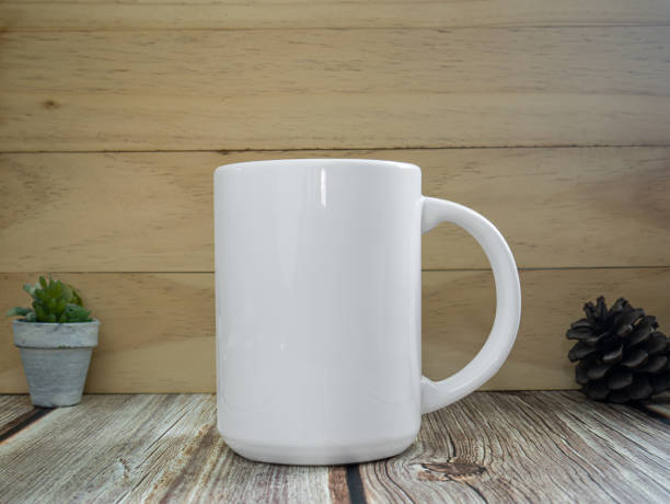 istock white mug on table wood for mockup or background 1326526901