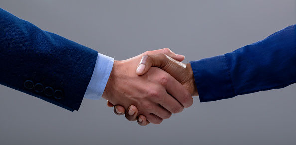 Cropped image of business men's hands making an agreement