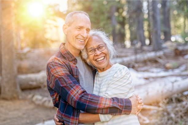istock Happy retired couple adventuring in forest 1326528496