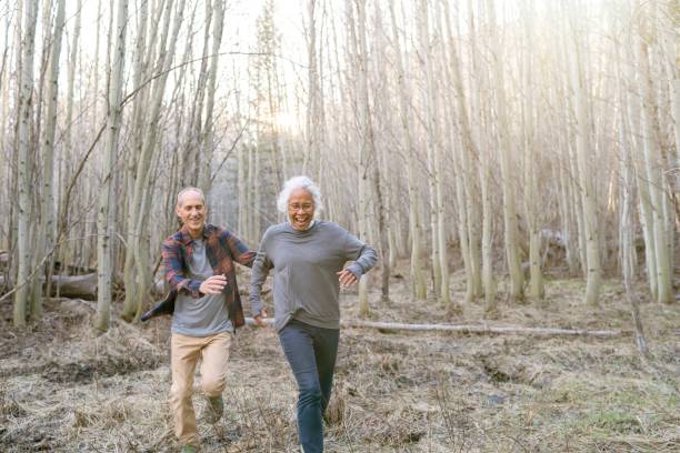 istock Playful senior couple having fun while out for a hike 1326528511