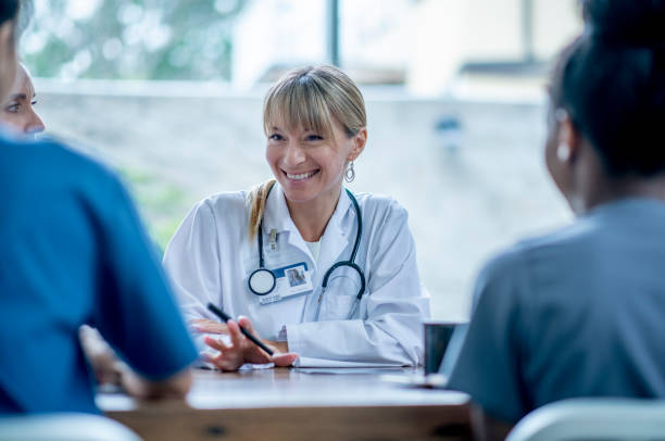istock Medical professional presents to her colleagues 1326528993