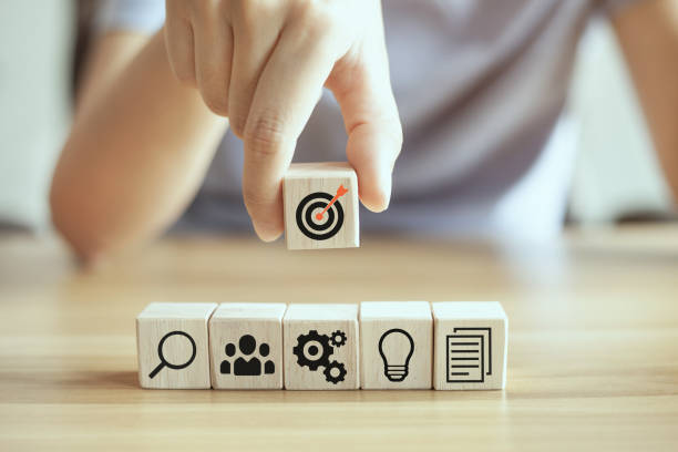 istock Closeup hand stack woods block step on table with icon business strategy and action plan 1326535051