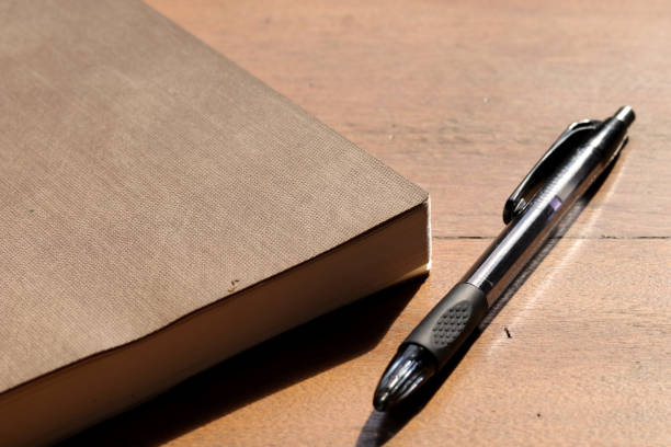 istock notebook and pen on wooden table 1326540000