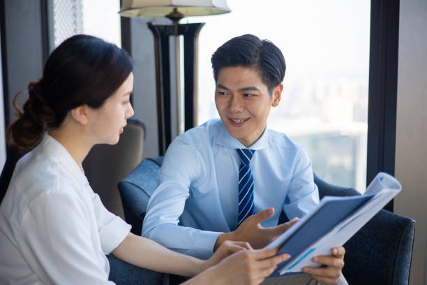 istock Two pensive business people discuss new business project 1326547238