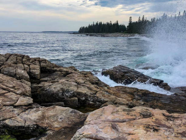 istock Waves crashing against rocks at national park 1326554685