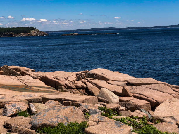 istock Beautiful rocks by blue water at national park 1326554711
