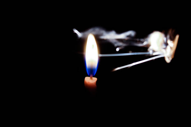 The match was sparked near the candle right behind it