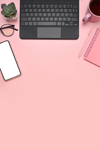 istock Top view laptop, mobile phone cactus and glasses on pink background. 1326557064