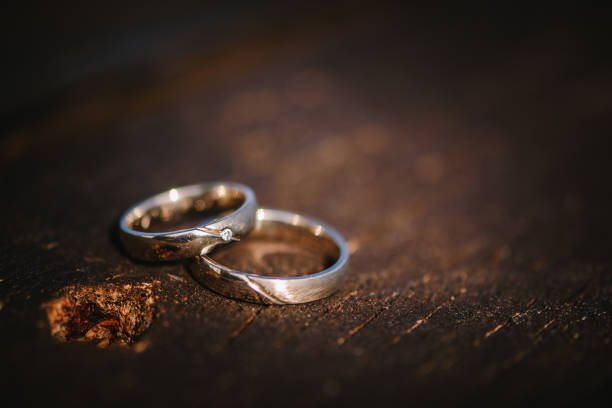 istock Wedding rings on a wooden surface. 1326559887