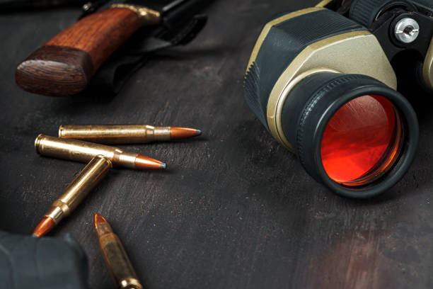 istock Hunting rifle and binoculars on dark wooden background 1326561947