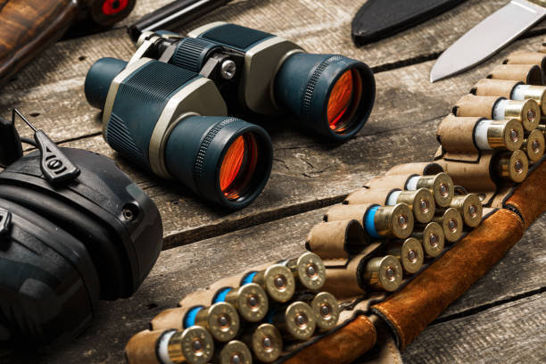 istock Hunting equipment binoculars on wooden background close up 1326563069