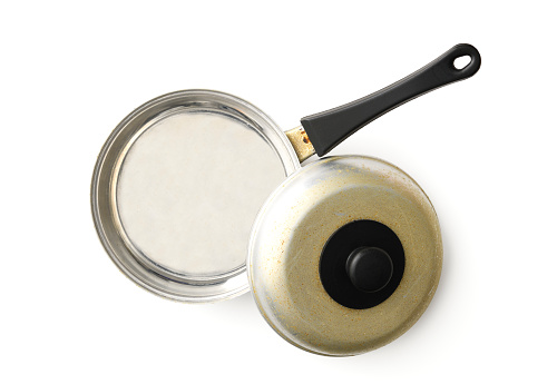 Overhead shot of old toy silver frying pan, isolated on white with clipping path.
