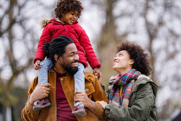 istock Happy black family communicating while spending a winter day in nature. 1326563928