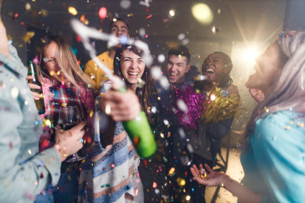 istock Cheerful friends having fun at home party. 1326564718