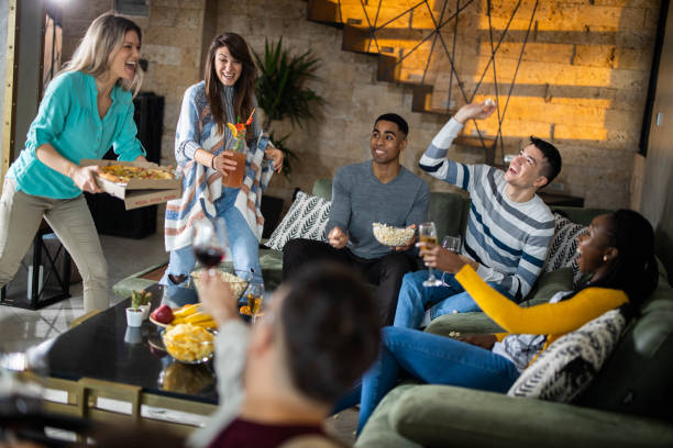 istock Cheerful friends having fun during social gathering at home. 1326564724