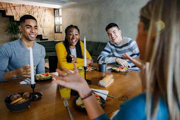 istock Young happy friends talking during lunch at home. 1326564856