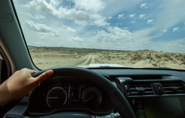 istock Driving off road car in the desert 1326564883