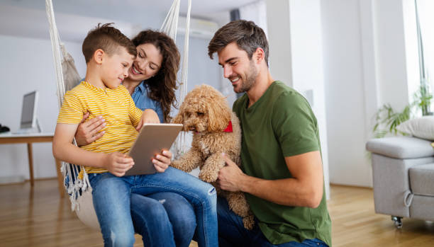 istock Happy modern family using computer together at home 1326565628