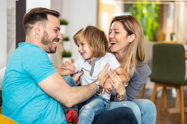 istock Young happy family having fun at home. 1326565778