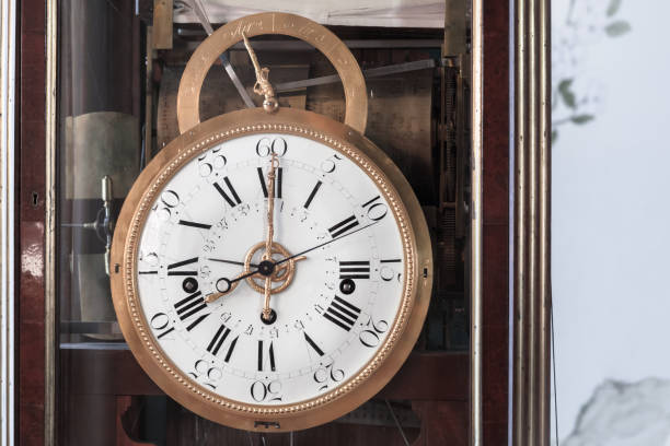 istock Vintage grandfather clock with white clock face. Close up 1326567901