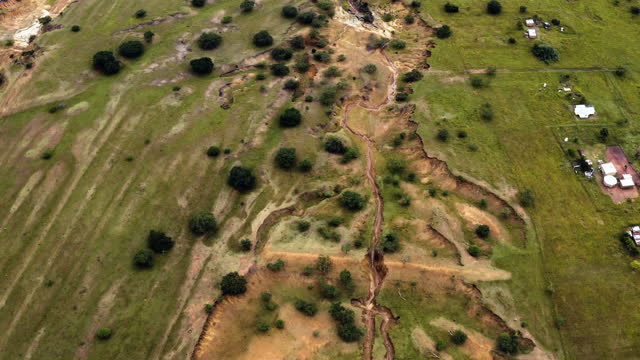 Aerial view of land destroyed by soil erosion from bad agriculture practices. Climate change and global warming