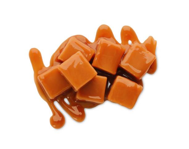 istock Caramel candies with topping on white background, top view 1326569634