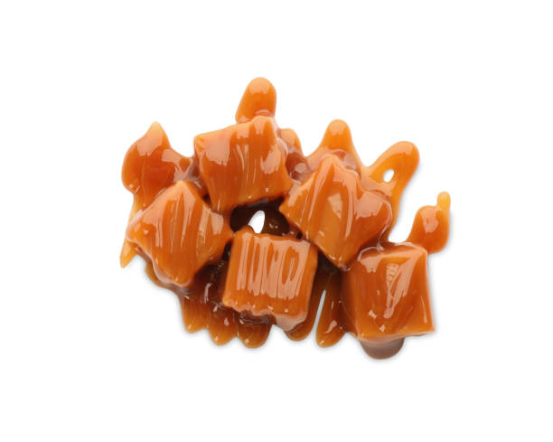 istock Caramel candies with topping on white background, top view 1326570402