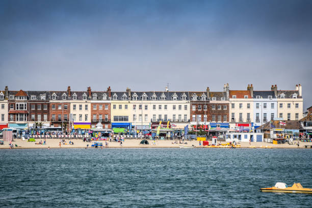 Crowded Weymouth Beach During Summer Days, UK Crowded Weymouth Beach During Summer Days, UK weymouth dorset stock pictures, royalty-free photos & images