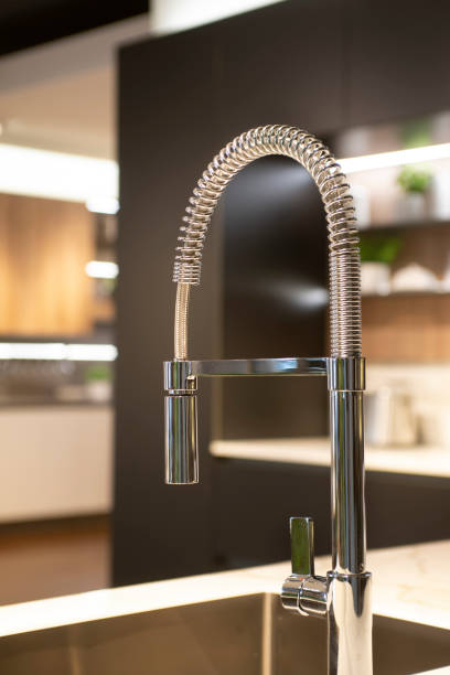 istock modern kitchen faucet - close up 1326577593