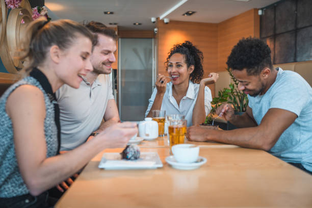 istock Multiracial Friends Enjoying Time Together in a Cafe 1326579021