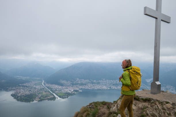 istock Female hiker contemplates view from mountain top 1326579413