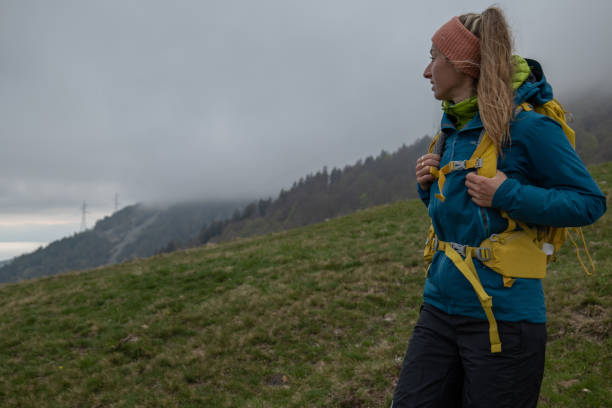 istock Woman hiking under the rain 1326579596