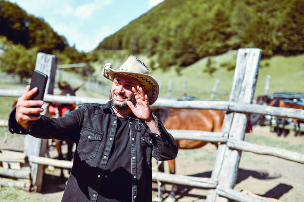 istock Cowboy Showing His Horses During Video Conference 1326579619