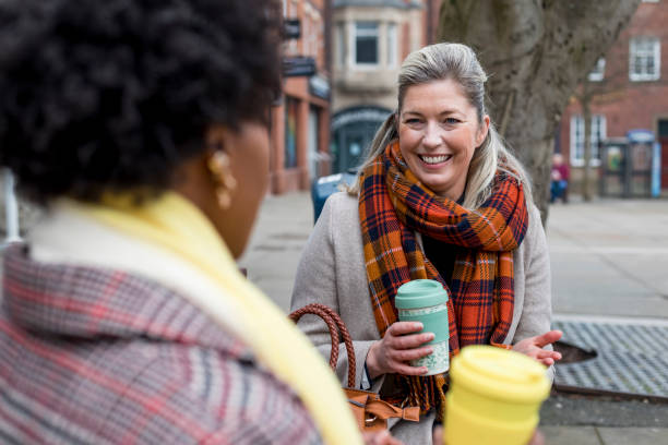 istock Catch-up Outdoors over a Hot Drink 1326579718